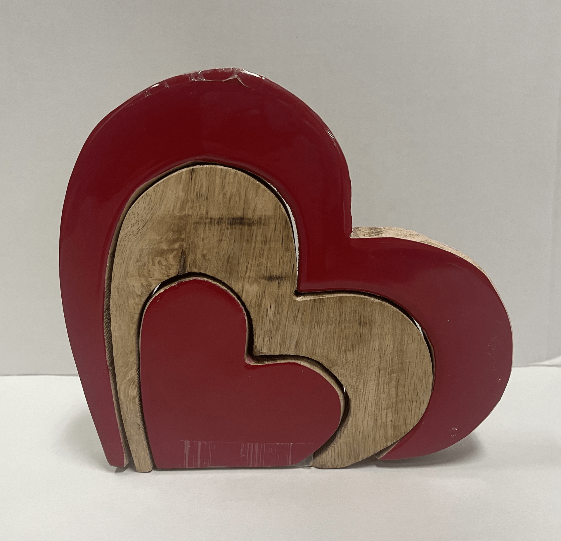 Red and brown wooden concentric heart puzzle decoration